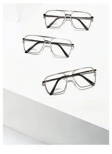 Detailansicht von drei Edelstahl-Brillengestellen in Gunmetal, Silber und Schwarz-Gold