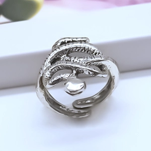 Vintage silver octopus tentacle open ring with center bead on a display stand