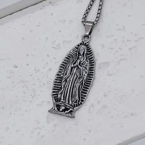 Oval stainless steel necklace with embossed Virgin of Guadalupe pendant and box chain