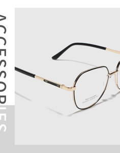 Macro side view of black and gold polygonal stainless steel glasses frame with detail