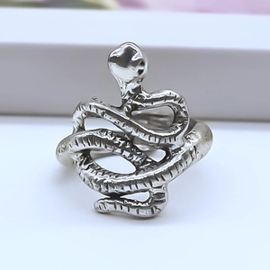 Detailed view of silver octopus snake ring with textured scale-like surface engraving