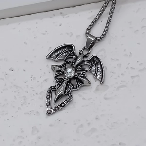 Gothic cross necklace with bat wings and clear zircon pendant on silver box chain