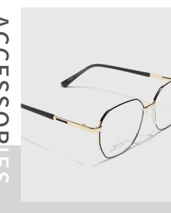 Macro side view of polygonal stainless steel glasses frame with dual-tone black and gold finish