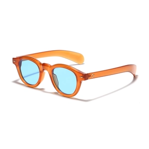 Retro round amber sunglasses with translucent blue lenses and golden rivets