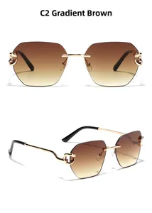 Detail view of rimless gradient brown sunglasses with gold chain temples and metal hardware