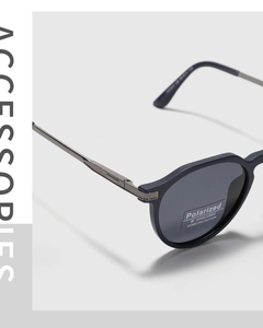 Detailed macro view of TR90 polarized sunglasses frame with metal hinge decorations