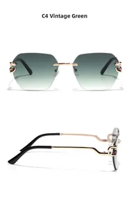 Detail view of retro green gradient lenses and gold metal temples of rimless sunglasses