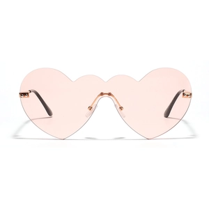 Lunettes de soleil cœur sans monture en rose, style Y2K avec détails métalliques dorés