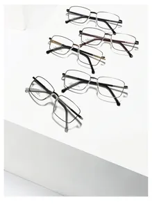 Macro view of five metallic square glasses frames in assorted colors on geometric stands