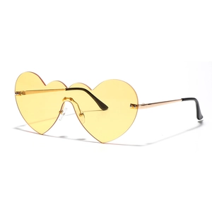 Lunettes de soleil cœur sans monture avec verres jaunes et branches en métal doré