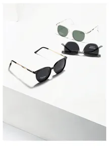 Detail view of TR7013 polarized sunglasses in black, clear, and grey on geometric stands