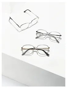 Close-up of minimalist square stainless steel frames in silver, grey and black gold