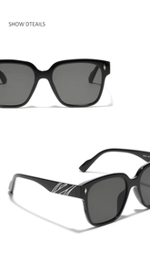 Detail view of square black sunglasses with silver rivet accents and white wavy temple patterns