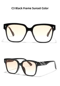 Detail of black square sunglasses with orange gradient lenses and silver temple accents