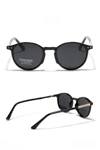 Detail view of round TR90 polarized sunglasses with gold temples and UV400 protection
