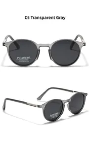 Detail of transparent grey round polarized sunglasses with metal lattice decor on temples