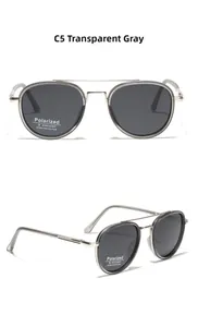 Detail of transparent grey round polarized sunglasses with double bridge metal frame