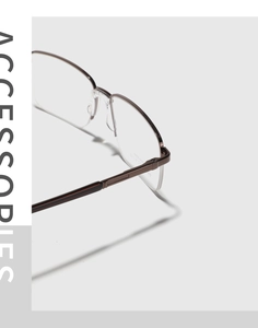 Detailaufnahme der hochwertigen Halbrand-Metallbrille mit polierter Oberfläche im Fokus