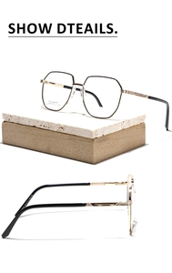 Detail view of hexagonal metal glasses frames with stainless steel and black-gold finish