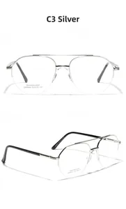 Detail of silver stainless steel half-frame glasses with double bridge and saddle nose pads