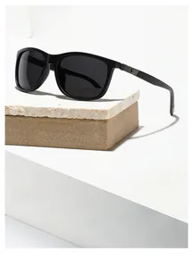 Detail view of black square TR90 sunglasses featuring silver metal E-shaped hinge accents