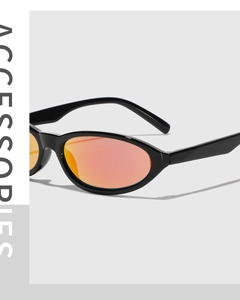 Side view of futuristic Y2K sunglasses with black frame and iridescent orange lenses