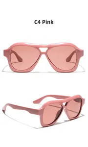 Detail view of pink double-bridge square sunglasses featuring integrated thick frame and CE mark