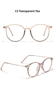 Detail view of round transparent tea TR90 eyeglass frames with slim metal temples