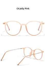 Detail view of round jelly pink TR90 frames with slim gold metal temples and C4 color code