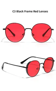 Detailed macro view of retro round sunglasses with black hollow frame and red lenses