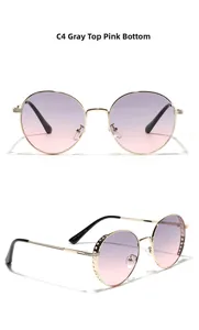 Detail view of round metal hollow sunglasses with grey to pink gradient lenses and model code