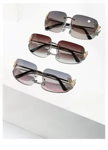 Detail view of model 8075 rimless square sunglasses with butterfly metal hinge accents