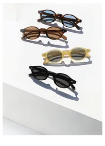 Group view of vintage oval sunglasses in four colors with rivet details and retro frames