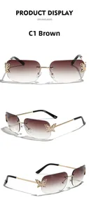 Detail of rimless square sunglasses featuring golden butterfly accents and brown lenses
