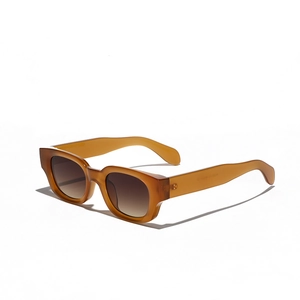 Retro amber cat-eye sunglasses with thick frames and brown gradient lenses for women