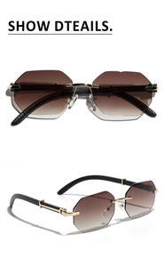 Detail of rimless octagonal sunglasses with gradient lenses and gold metal temples