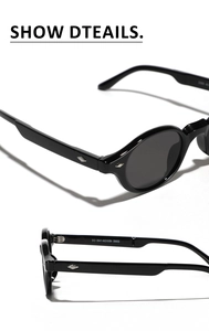 Close-up of vintage oval sunglasses with silver metal hinges and sleek black frames