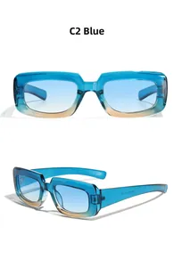 Detail view of square blue gradient sunglasses with blue tinted lenses and inner arm specs