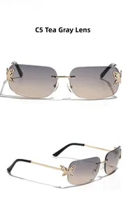 Detail of Y2K rimless square sunglasses with gold butterfly hinges and tea grey lenses