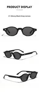 Macro shot of glossy black oval sunglasses featuring high-quality gray lenses and metal hardware