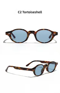 Detailed views of tortoise shell oval sunglasses frame with blue tinted lenses