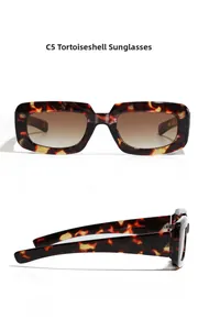 Detail view of tortoiseshell square sunglasses with brown gradient lenses and size parameters