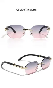 Detail view of rimless octagonal sunglasses with grey pink gradient lenses and gold bridge
