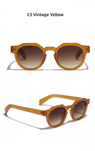 Close-up of vintage yellow round frame sunglasses with metal studs and brown lenses