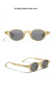 Detail view of oval jelly green retro sunglasses with dark grey lenses and metal rivets