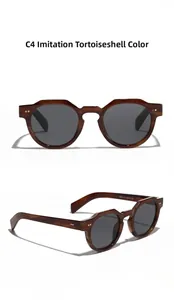 Detail of vintage round sunglasses in C4 dark brown acetate finish with grey lenses