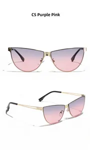 Detail view of cat eye sunglasses with C5 purple-pink gradient lenses and gold metal frames