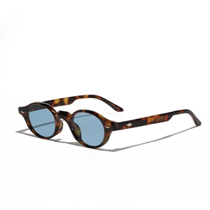 Retro oval sunglasses with tortoiseshell frames and light blue lenses in 45-degree view