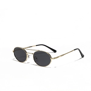 Retro double-bridge metal sunglasses with gold frames and black oval lenses in top-down view