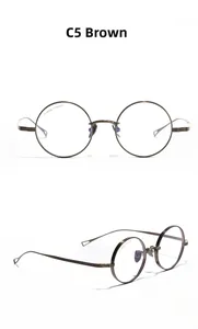 Detailed views of round titanium glasses frames in brown with triangular cut-outs